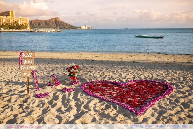 Sunset Proposal at Waikiki Beach with a rose petals heart in the sand