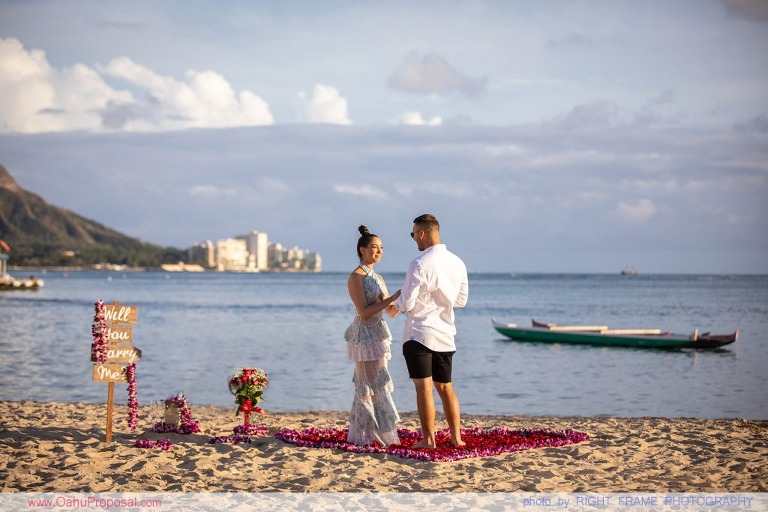 Sunset Proposal at Waikiki Beach with a rose petals heart in the sand