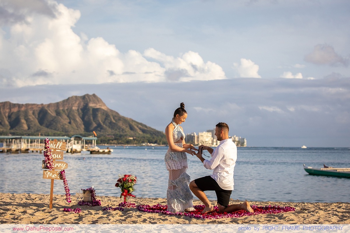 Sunset Proposal at Waikiki Beach with a rose petals heart in the sand