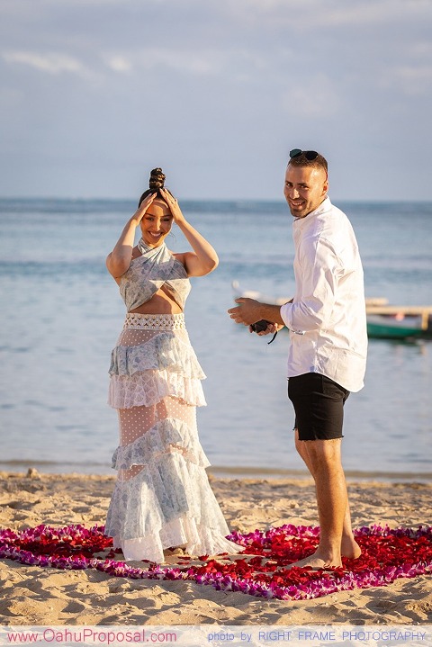 Sunset Proposal at Waikiki Beach with a rose petals heart in the sand