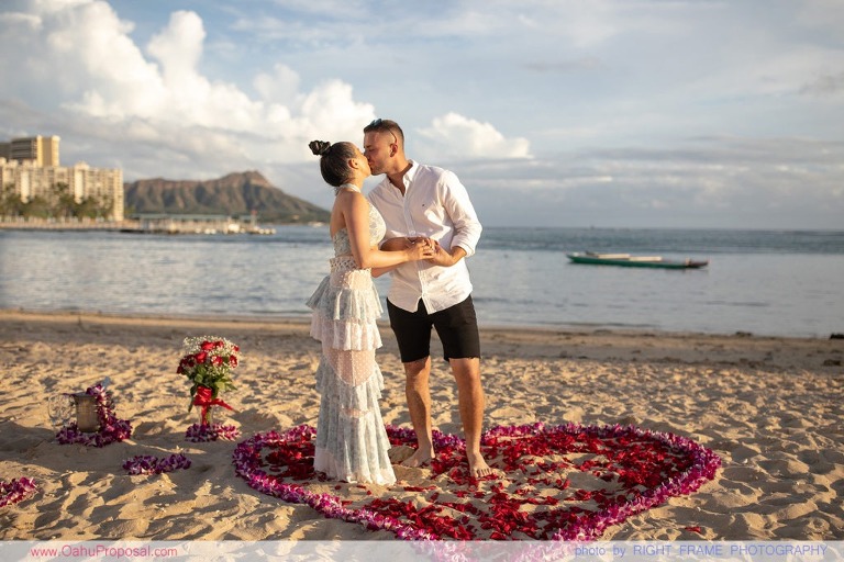 Sunset Proposal at Waikiki Beach with a rose petals heart in the sand