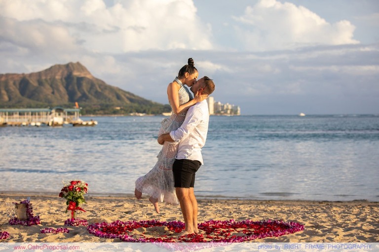 Sunset Proposal at Waikiki Beach with a rose petals heart in the sand