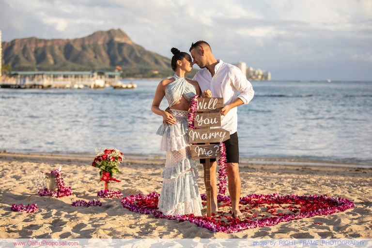 Sunset Proposal at Waikiki Beach with a rose petals heart in the sand