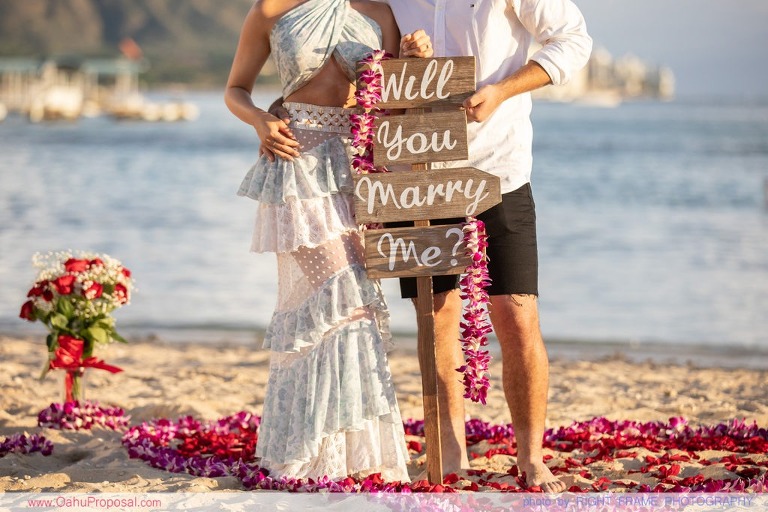 Sunset Proposal at Waikiki Beach with a rose petals heart in the sand