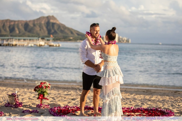 Sunset Proposal at Waikiki Beach with a rose petals heart in the sand