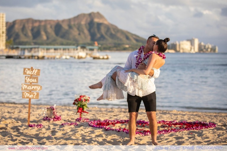 Sunset Proposal at Waikiki Beach with a rose petals heart in the sand
