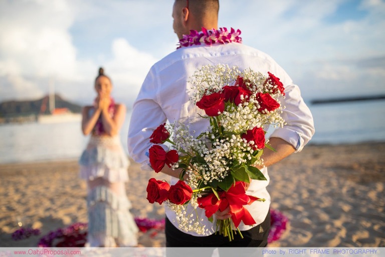 Sunset Proposal at Waikiki Beach with a rose petals heart in the sand