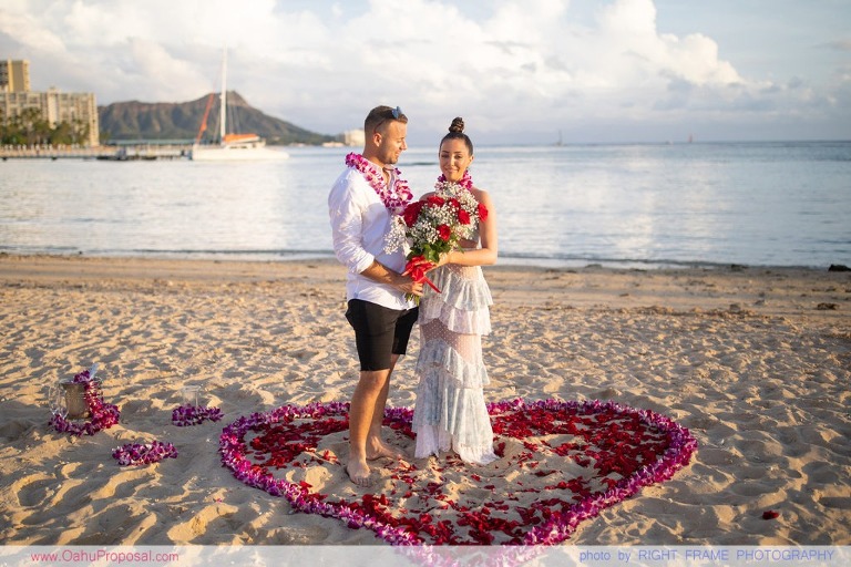Sunset Proposal at Waikiki Beach with a rose petals heart in the sand