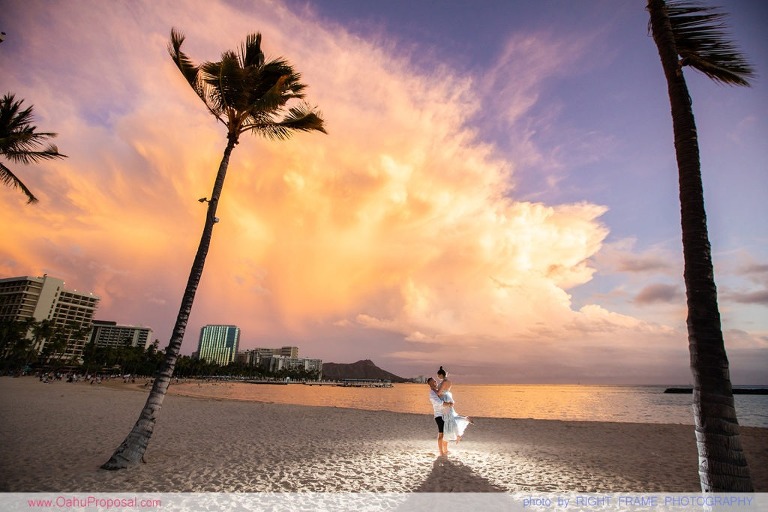 Sunset Proposal at Waikiki Beach with a rose petals heart in the sand