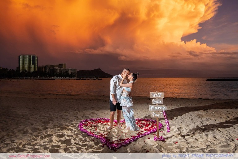 Sunset Proposal at Waikiki Beach with a rose petals heart in the sand