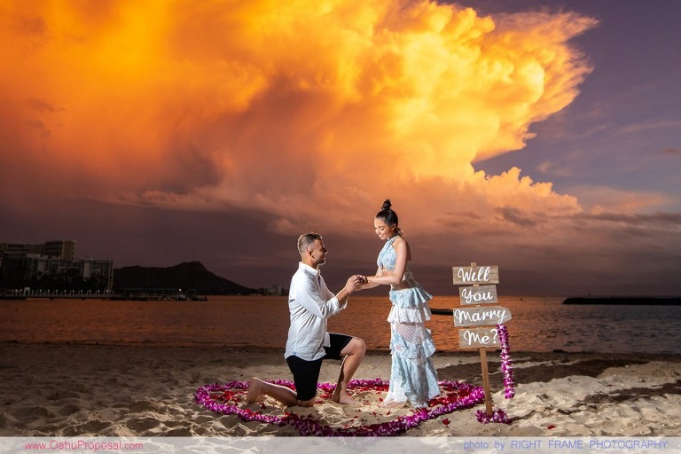 Sunset Proposal at Waikiki Beach with a rose petals heart in the sand