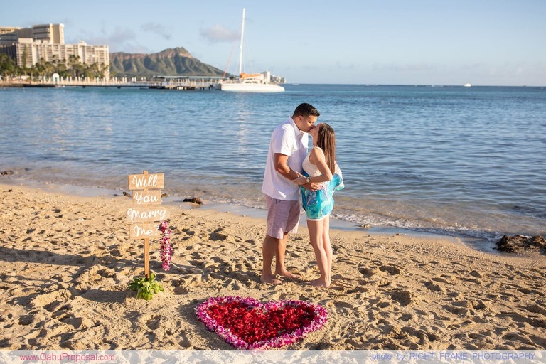 Surprise beach proposal with Diamond Head in the background Hawaii