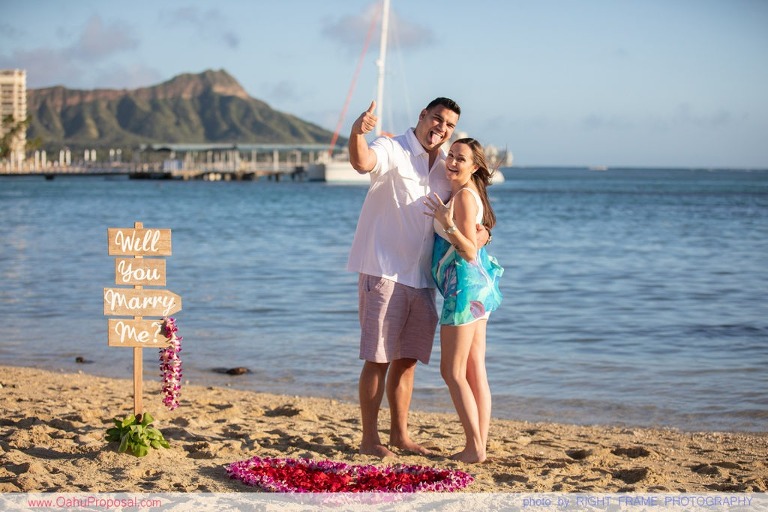 Surprise beach proposal with Diamond Head in the background Hawaii