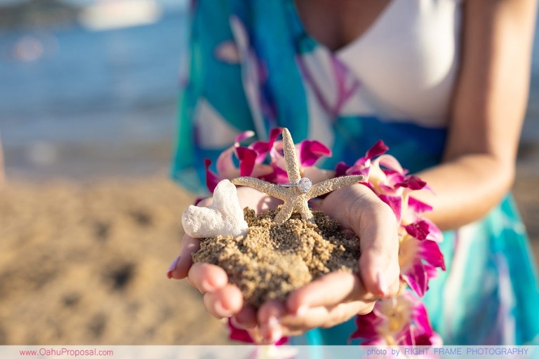Surprise beach proposal with Diamond Head in the background Hawaii