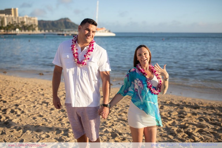 Surprise beach proposal with Diamond Head in the background Hawaii