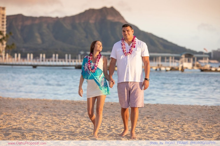 Surprise beach proposal with Diamond Head in the background Hawaii