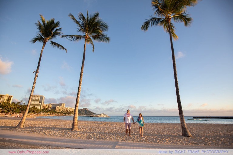 Surprise beach proposal with Diamond Head in the background Hawaii